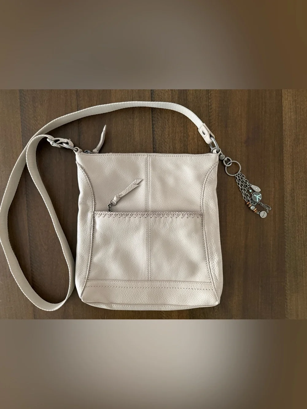 The Sak Soft Pebbled Cream Leather Crossbody with Charm Tassel